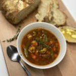 bowl of stew and loaf of bread