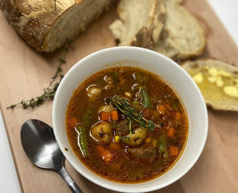 bowl of stew and loaf of bread